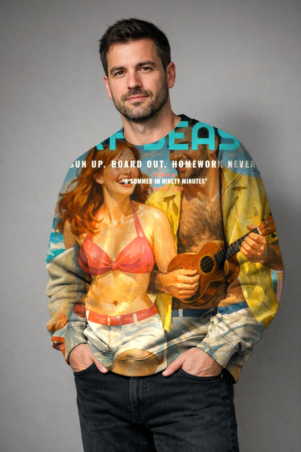 A man in a crewneck sweatshirt printed edge to edge with the Beach Party 1963 poster of June and Theo, hands in his pockets, studio light
